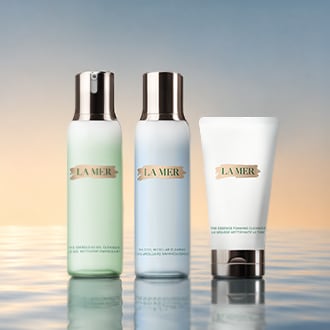 Close up of model cleansing skin, focusing on product texture on skin